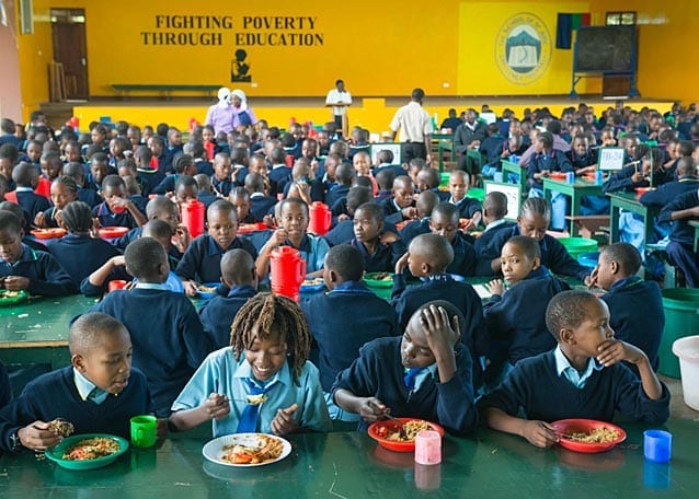 Lunch time! Peter and his friends in the Upper Primary dining hall. Tuesday’s lunch is ugali and beans.