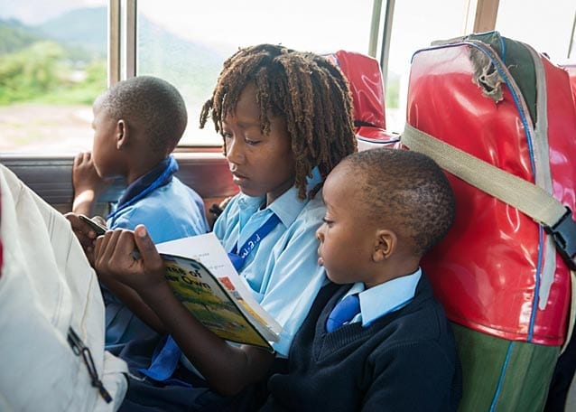 On Friday afternoon Peter rides the school bus home to his family.