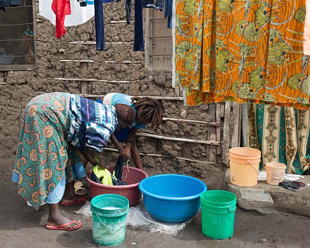 Washing is done outside in buckets that they fill with water from a tap that is a few metres from their house.