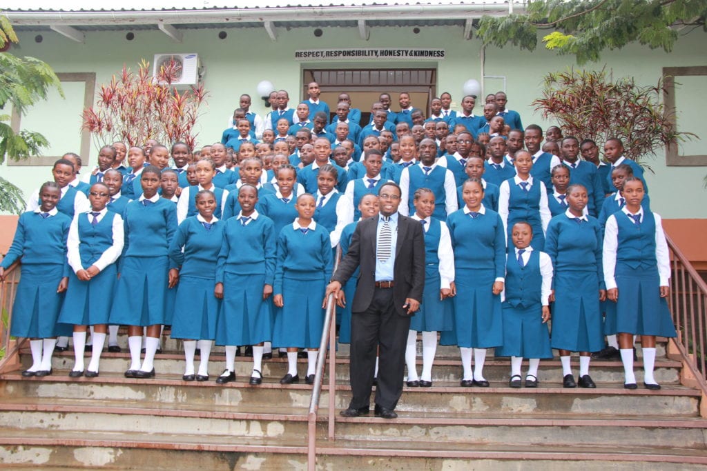 St Jude's Secondary Headmaster Rasul Abdul with Form 5 students at St Jude's Smith campus