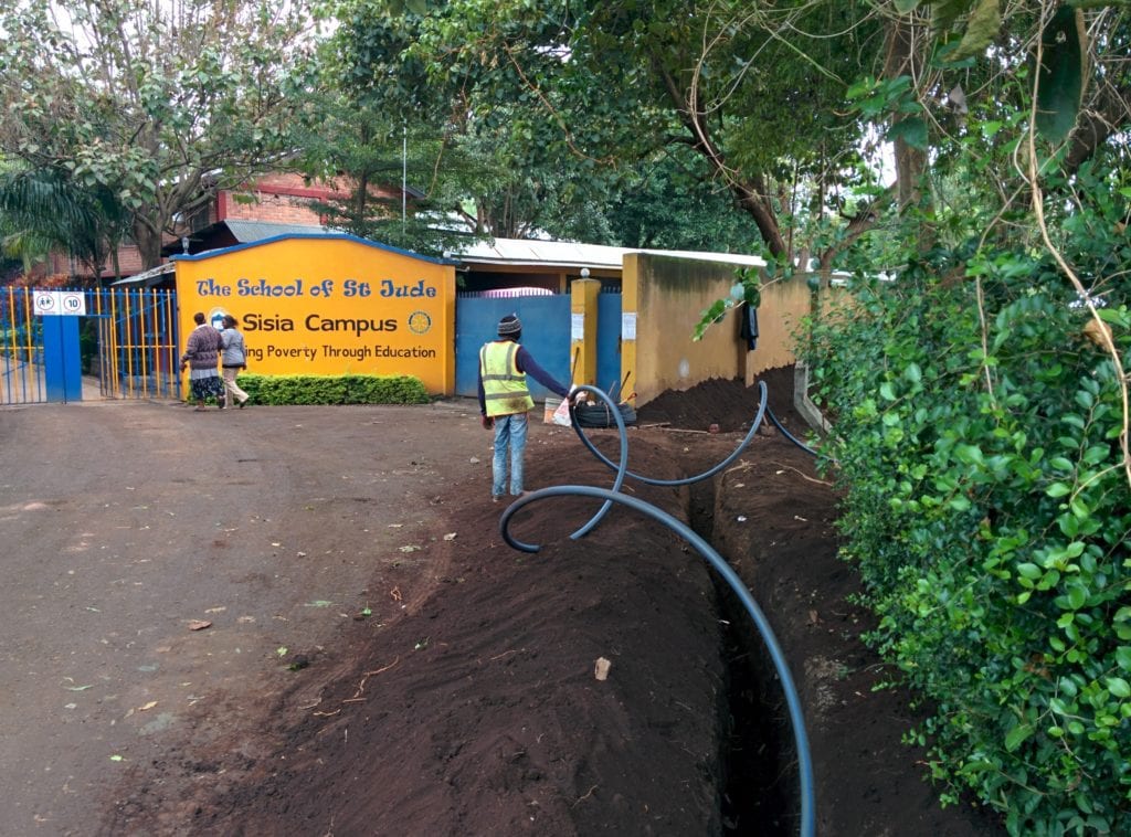 Workers putting in the fibre optic cable at our Moshono campus.