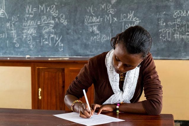 Big job: Esther is teaching up to 90 students in one of her classes. "Some of the students... cannot even write their own names," she said.