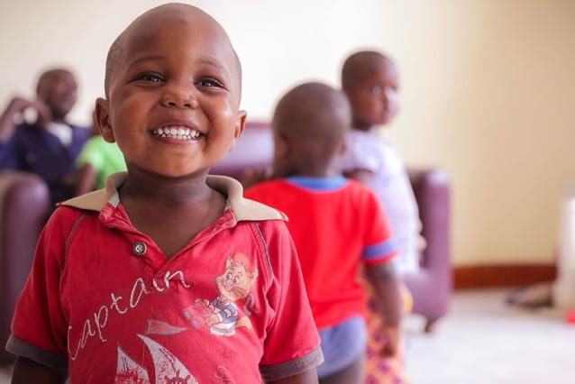 Christmas cheer: The orphans at Neema House, one of 10 that received a gift hamper from St Jude's, were happy with the visit.