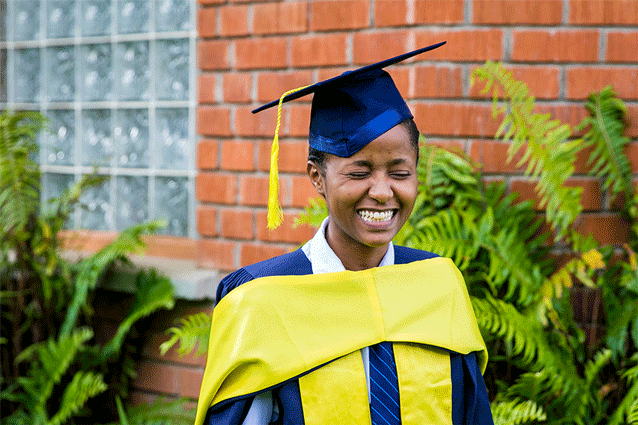 Future so bright she needs shades: Winnie caught in a candid smile in her graduation gown.