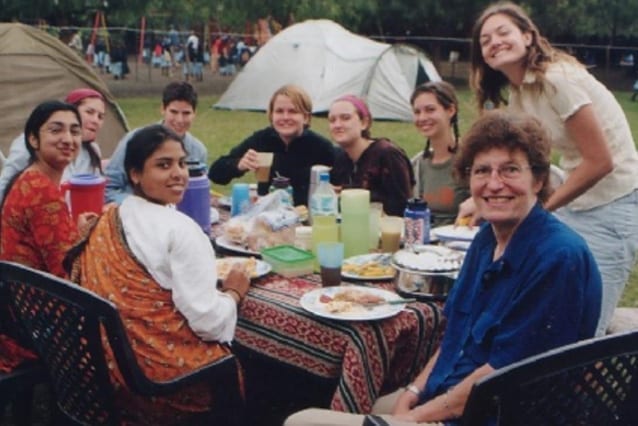 Humble hero: Louise (right, in blue) on her first visit to the school in 2005.