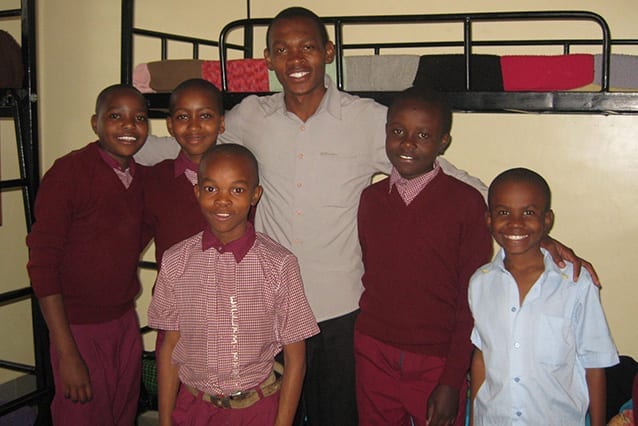 Band of boarders: Emmanuel with some of his charges at the beginning of his Community Service Year.