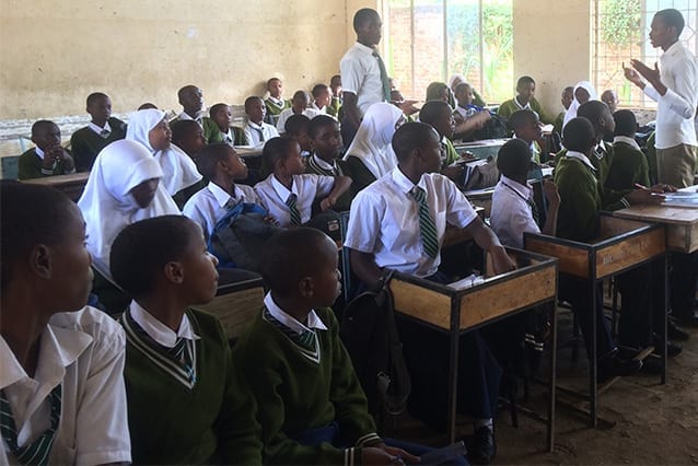 Enraptured audience: Emmanuel commands the attention of his students and is comfortable in his role despite limited resources.