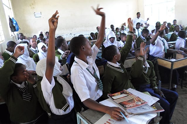 Baptism of rapid fire questions: Mr Emmanuel immersed in his classroom.