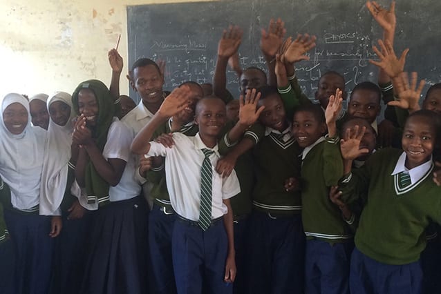 There will be tears: Emmanuel's students help him wave goodbye to St Jude's first year of community service.