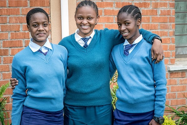 Sisterly love: Gloria (center) and her two 'sisters' Vanessa (left) and Tatu (right).