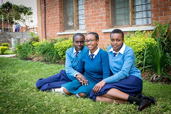 Little, big sister: Kareen and her much taller little sisters, Jackline and Janeth.