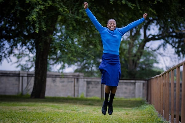 Jumping for joy: the grateful future leader is on the highway to greatness.