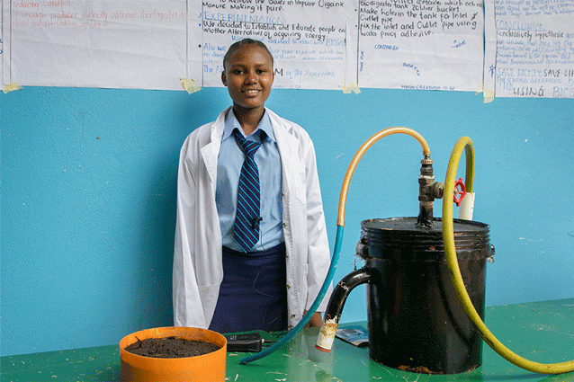 Creating cleaner, cheaper energy: Clever Clara in Form 3 with her brilliant bio-gas project.