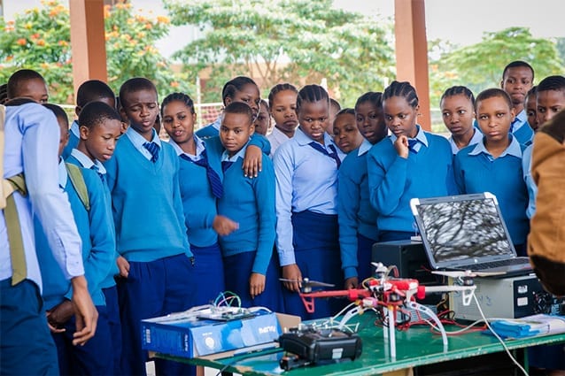 Poachers beware: Students crowd around the quadcopter anti-poaching display.