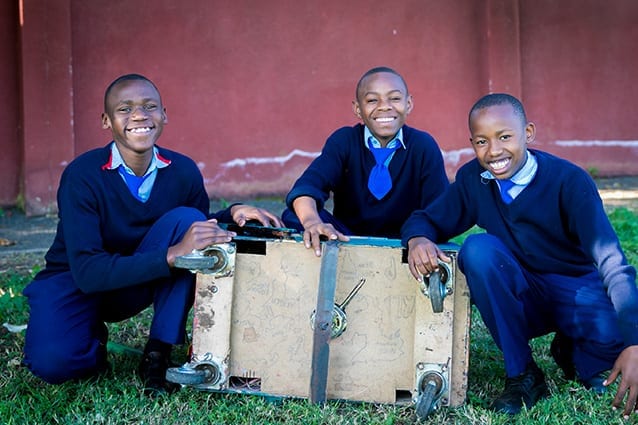 Scavenger hunt: Boniface, Goodluck and Mikidadi searched high and low for the parts they needed to make their dream invention come true.