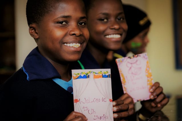 All smiles: The girls show off their handicrafts.