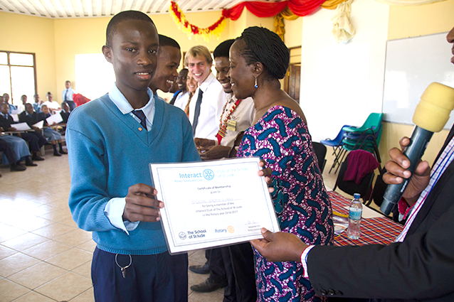 Mission accomplished: Form 4 student Nickson is proud to be part of the official ceremony.