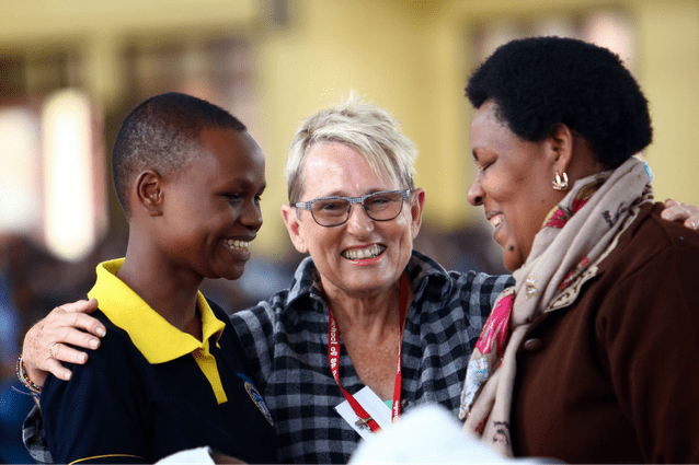 Thankful: Noela and her sponsored student, Oliva, having fun at our very first graduation in 2015.