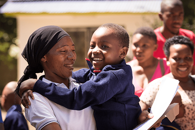 Pride and joy: Our parents are thrilled to see their children dressed in their new uniform.