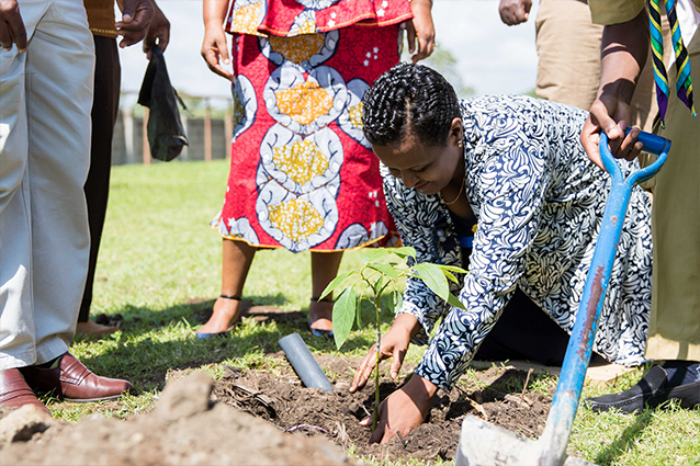 Growing memories: Our guest of honour plants a tree to commemorate this special moment.