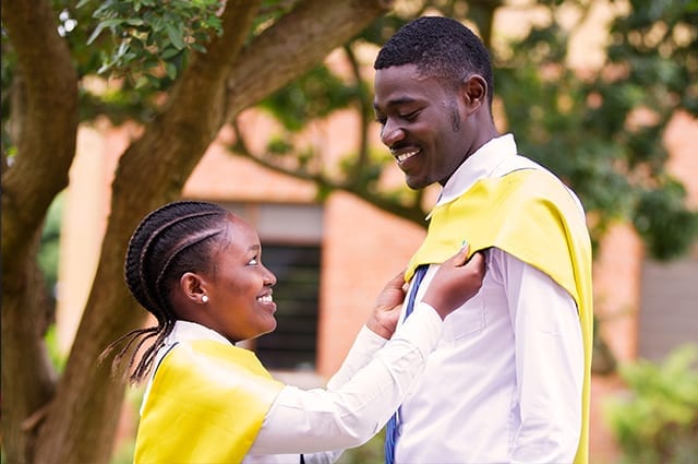 Straighten up and graduate right: Students took pride in the day's formalities.