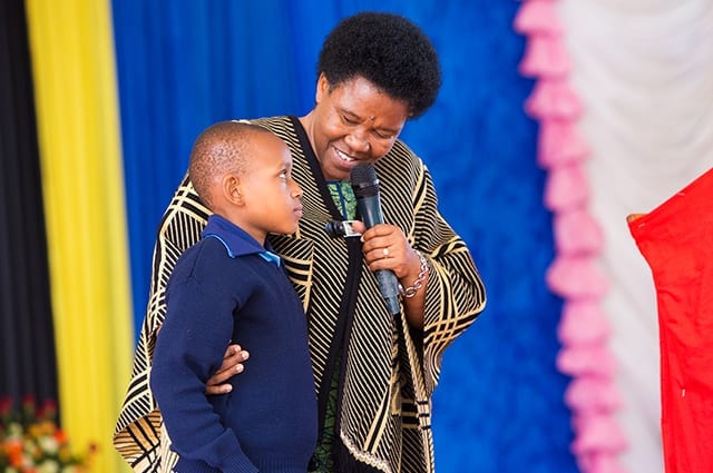 Thoughtful, committed citizens can change the word: Mama Mchombe imparts wisdom to a future graduate.