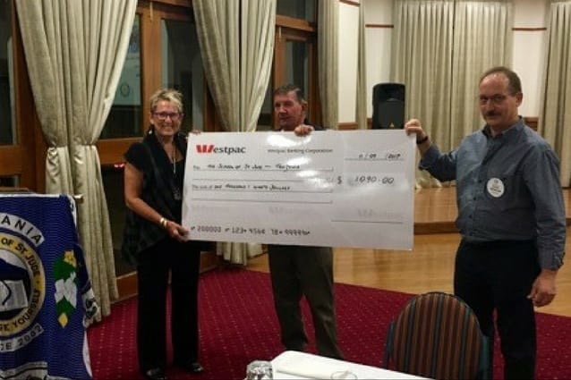 All smiles: Noela receives a donation from the Gladstone Rotary Club.