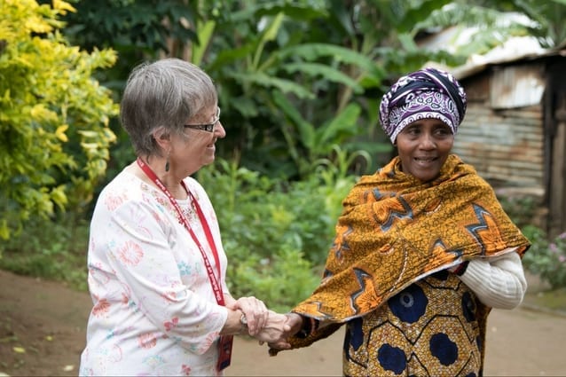 Maternal connection: Pat is welcomed by Robinson's proud mother. 