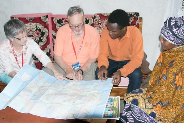 A 'Rapid' connection: The Sutliffs point out Rapid City on the world map.
