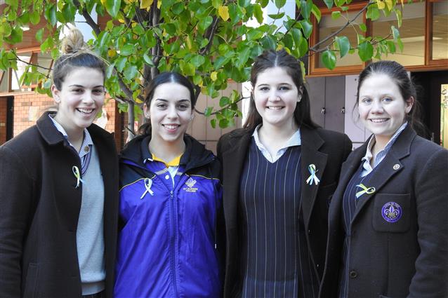 Sealed with a bow: Year 12 students Anna, Dimiti, Clare and Maddie sold hand-made St Jude's ribbons. 