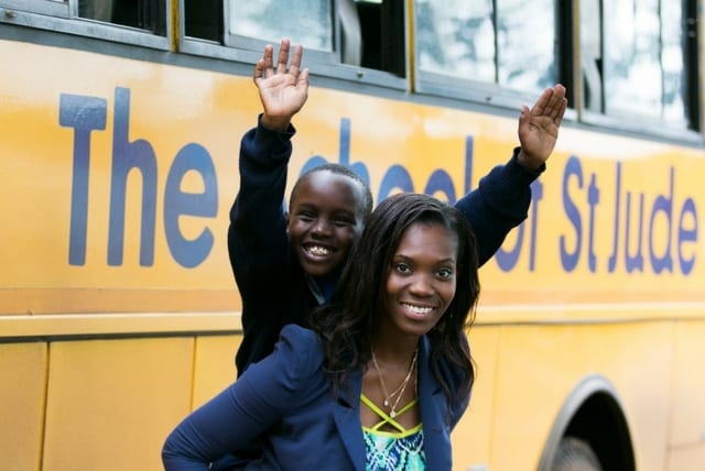 Lifting up future leaders: Anna and her adoring student, Joseph.