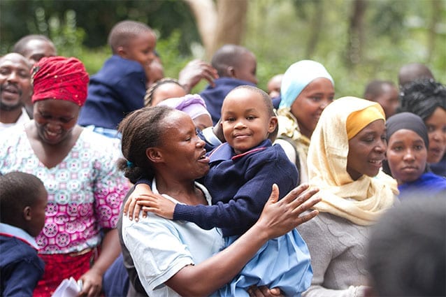 Moment of joy: With tear-filled eyes, Veronica congratulates her young daughter, Maureen.