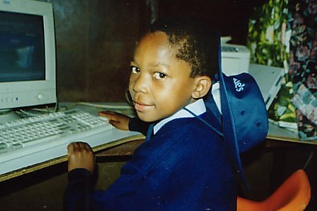 Destined for great things: Amani's education at St Jude's gave him access to technology and learning resources.