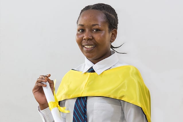 Glowing graduate: Irene with her graduation scroll at 2017 Form 6 Graduation. 