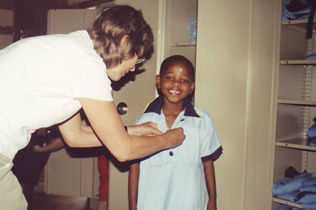 Leading lady: Diana, receiving her first St Jude's uniform more than 10 years ago. 