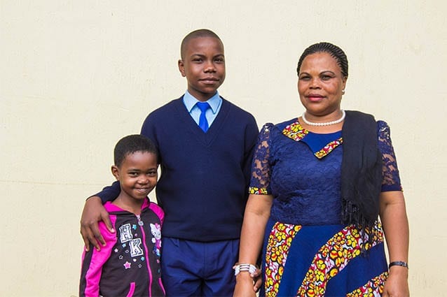 A proud family: Samson pictured with mother and young sister.