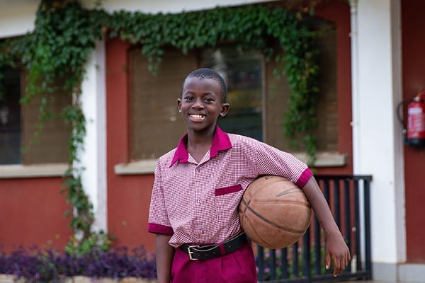 Big dreams: Fifth grade student, Baraka, enjoys the after school sports offered as part of the boarding experience.