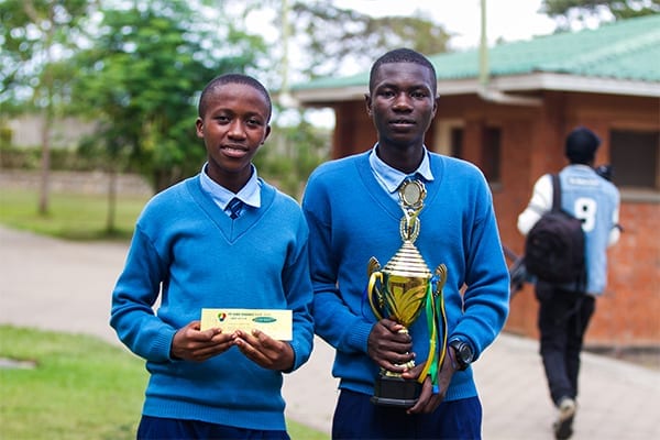 Future Inventors: Form 4 St Jude's students, John and Steven, celebrate taking out first prize at the 2019 Science Day.