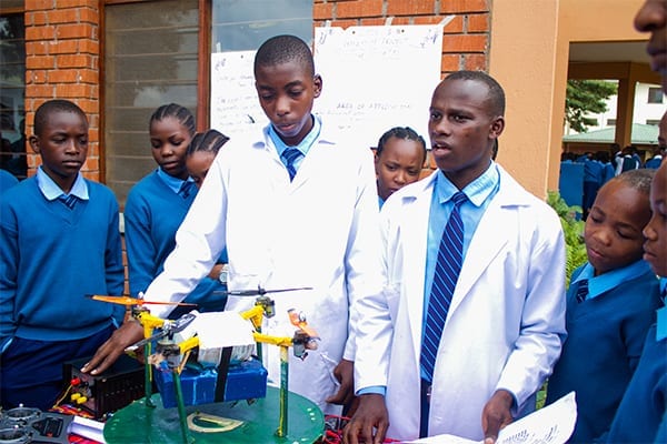 Future Inventors: Form 4 St Jude's students, John and Steven, celebrate taking out first prize at the 2019 Science Day.