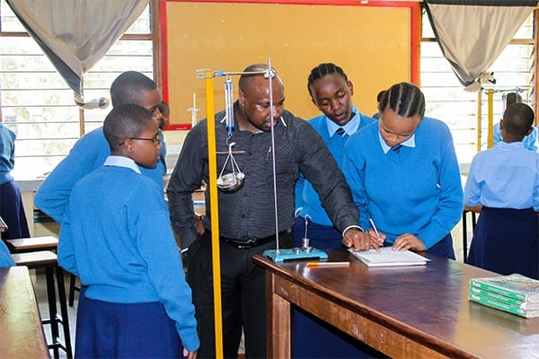 Leading the way: Mr Mcharo advises Form 1 students during his class. 