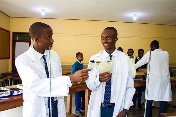 Lab coated leaders: David discusses his project to help with the plastic bag ban with his lab partner.