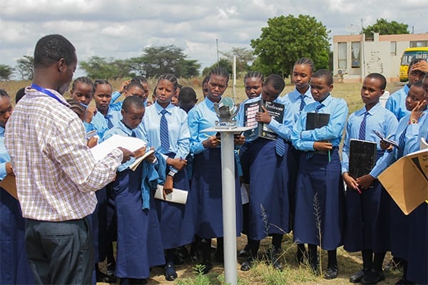 Educational Excursion: Form 1 students listen to the airport's tour guide. 