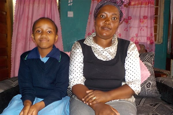 A Mothers' Love: Committee Chairperson, Elizabeth, with her daughter Nice, who is now in Form 1.