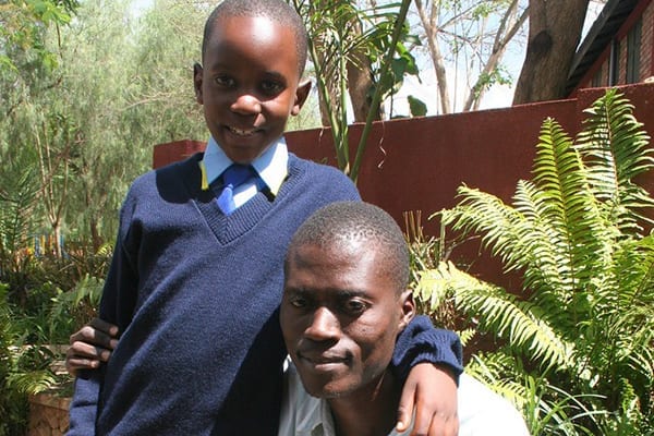 Doing it for Dad: Daudi with his father, Stephano, when Daudi was accepted into The School of St Jude in 2009. 