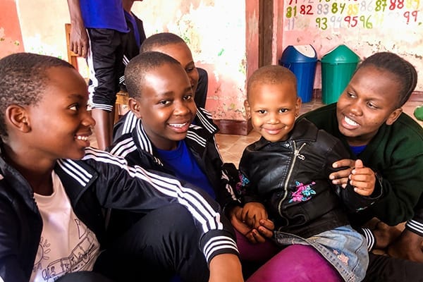 Heartwarming Smiles: After chores students spend time playing together, a highlight for all!