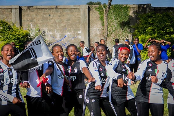 Soccer Support: Form 2 students cheer on the school soccer team.