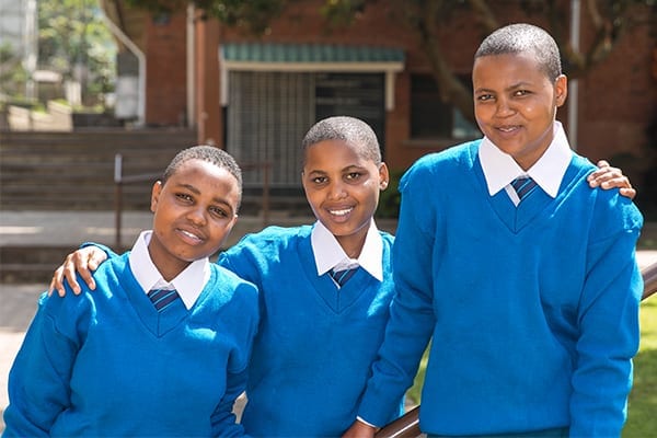 A New Start: Febronia, Editha and Jeniva on their first day as Form 5 students at St Jude's.