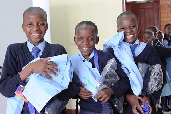 Uniform Record: Students receiving their new uniforms that will be produced at a record number this year.