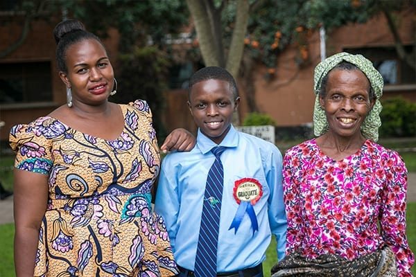 Family time: Johnson (centre) with Elinipe (sister, left) and Apatikis (Bibi, right)