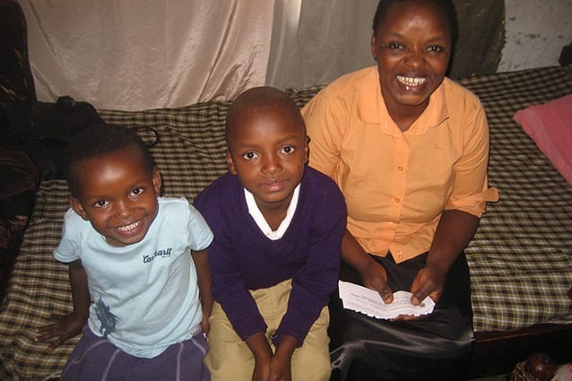 Happy family: Christopher at home with his mama and sister.